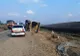 FOTO: Camion plin cu pietriș, răsturnat pe o șosea din Bistrița-Năsăud, după o explozie a unui cauciuc! Șoferul a ajuns la spital